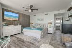 King bed, large flat panel tv, large dresser, beautiful beach decor